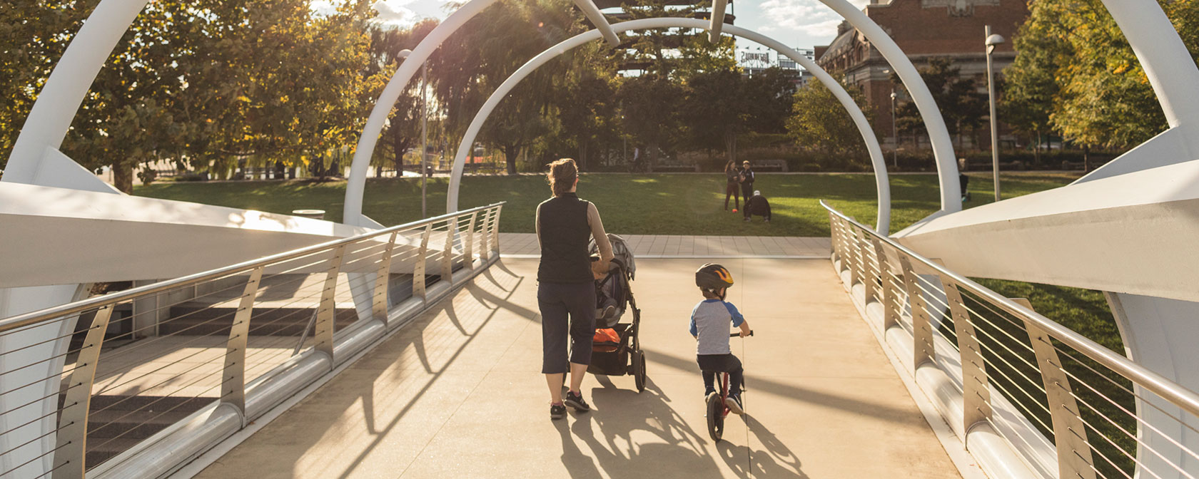 Family crossing the Capitol Riverfront Bridge