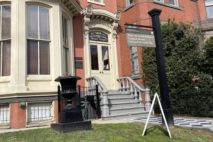 Front entrance of the Mary McLeod Bethune Council House, designated as a National Historic Site, with a sign and historic architectural details.