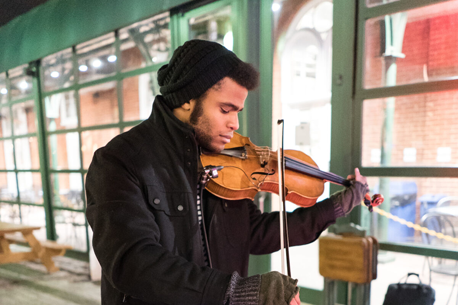 Man playing Violin in Cold Weather