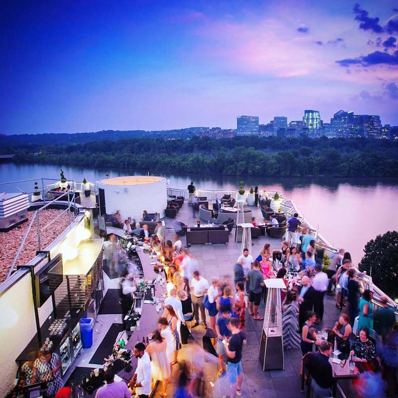 @watergatehotel - Top of the Gate rooftop bar at The Watergate Hotel - Sunset overlooking Potomac River in Washington, DC