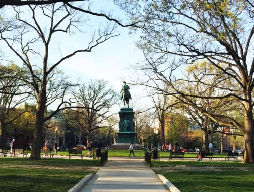 People enjoying Logan Circle on a spring evening - Neighborhoods in Washington, DC